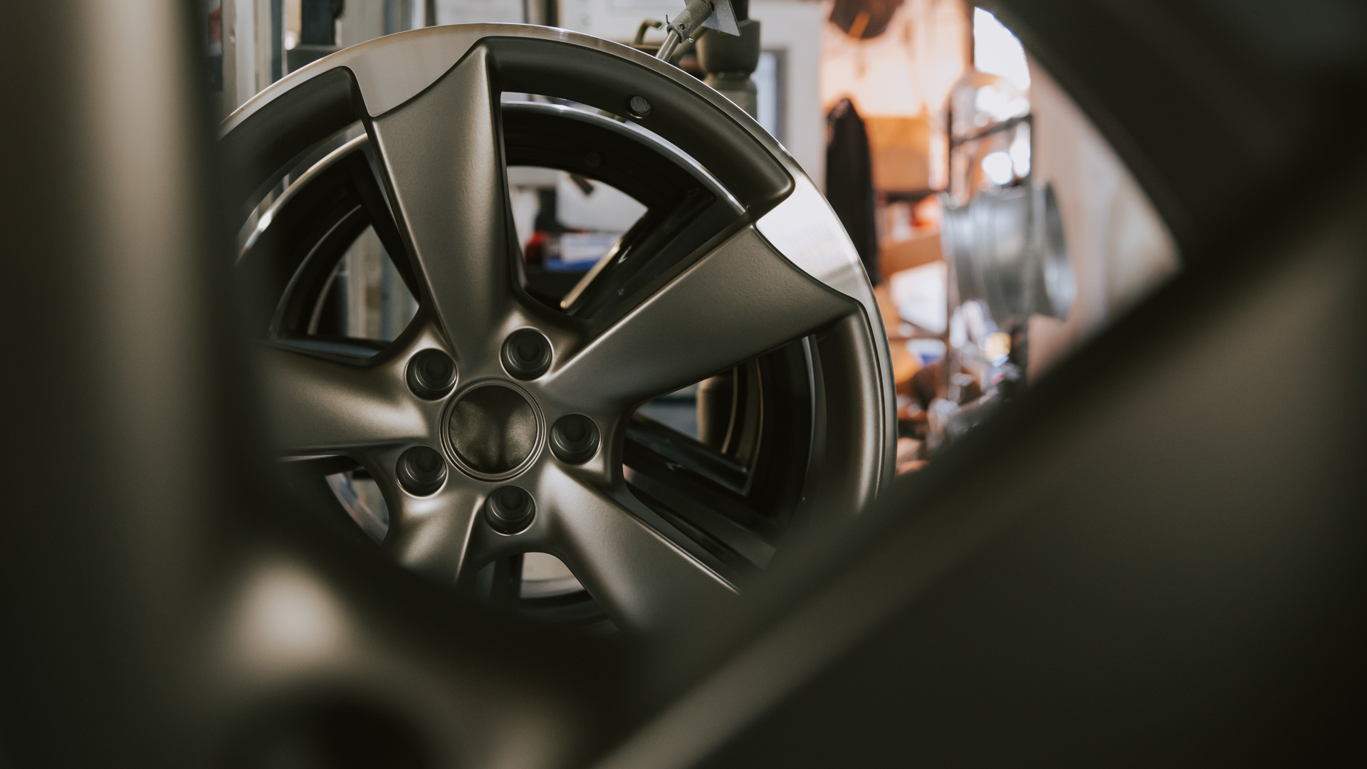 An Alloy Wheel Being Quality Inspected After Refurbishment and Repair