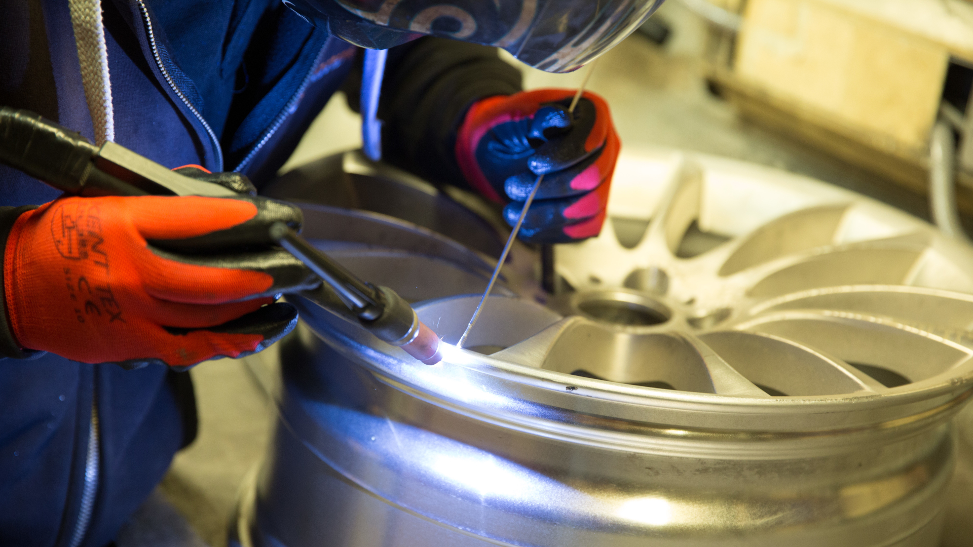 Repairing the wheel by straightening or welding.